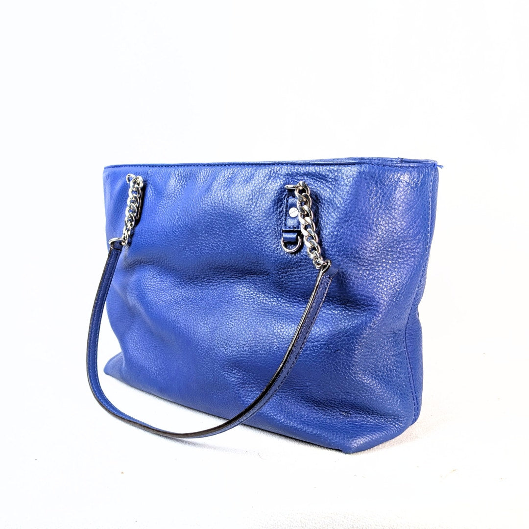 Pre-owned Michael Kors Jet Set East West Chain Tote Bag in Blue photographed from the side.