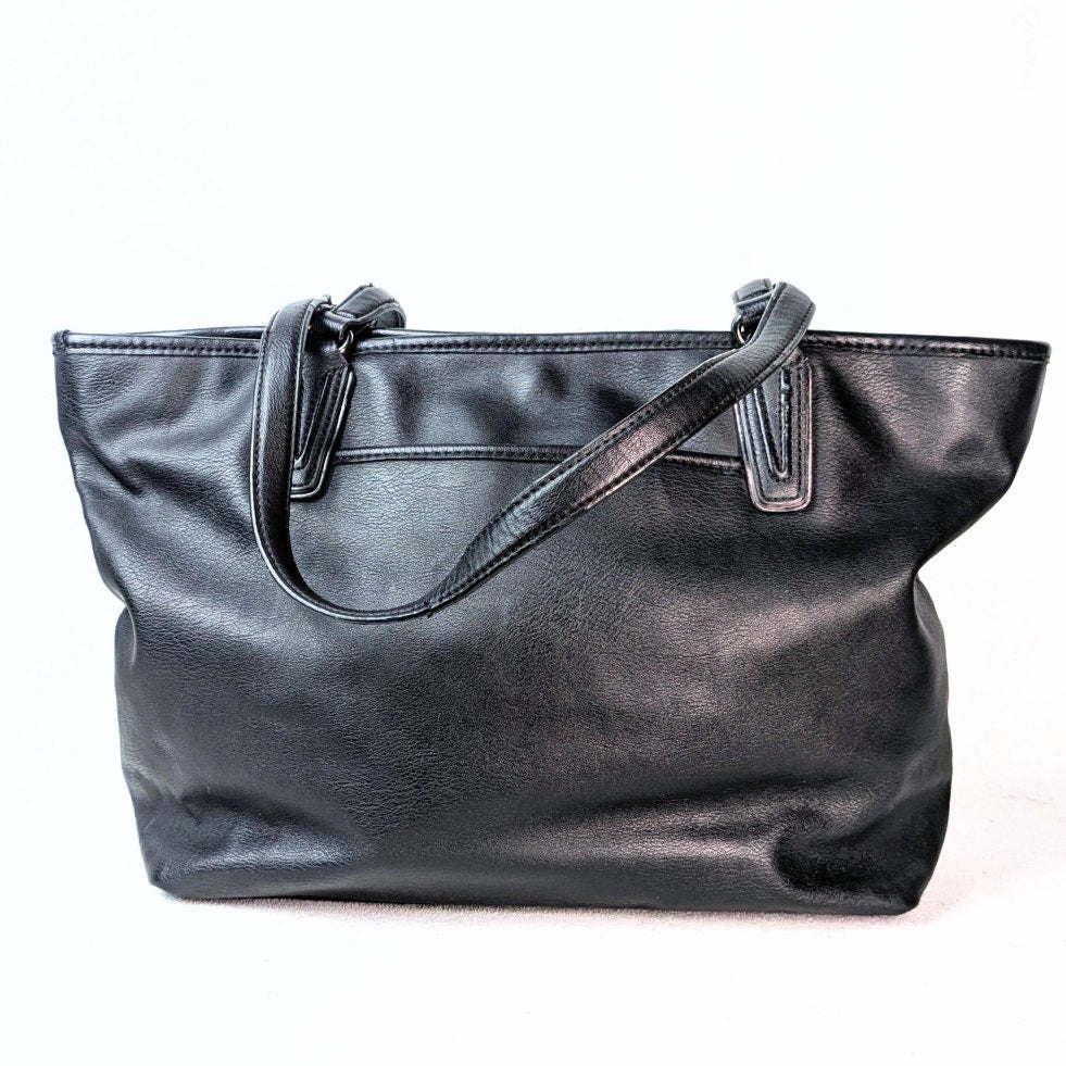 The back side of the Simply Vera Vera Wang Black Tote Shoulder Bag in Black on the white background.