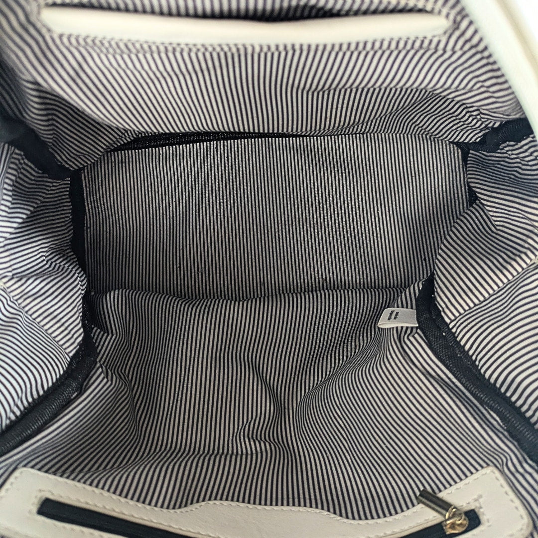 The inside view of the Unbranded Faux Leather Backpack.