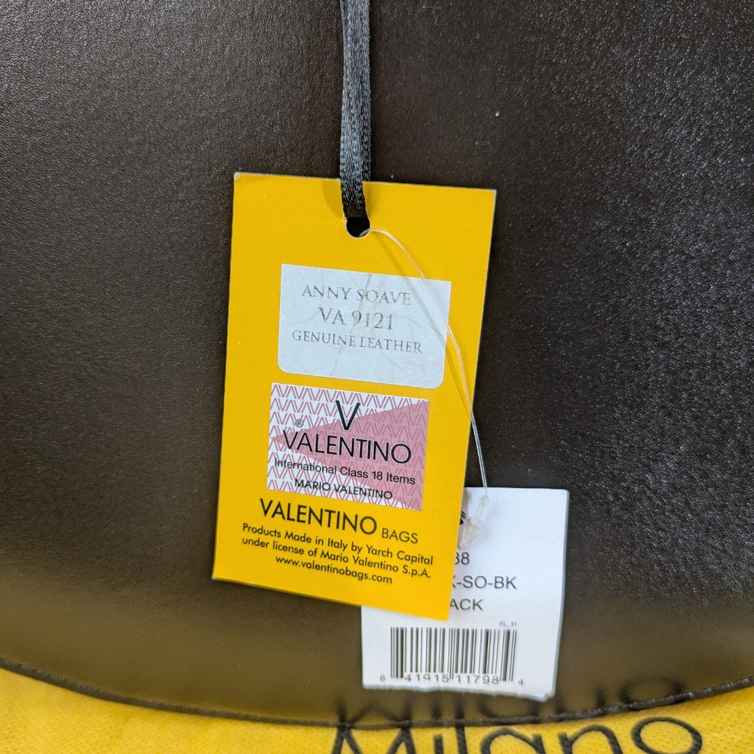 The tags of the Valentino by Mario Valentino Anny Soave Shoulder Bag in Black.