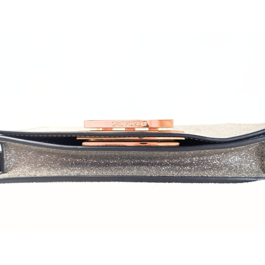 The bottom of the Zac Posen Glitter Evening Clutch.