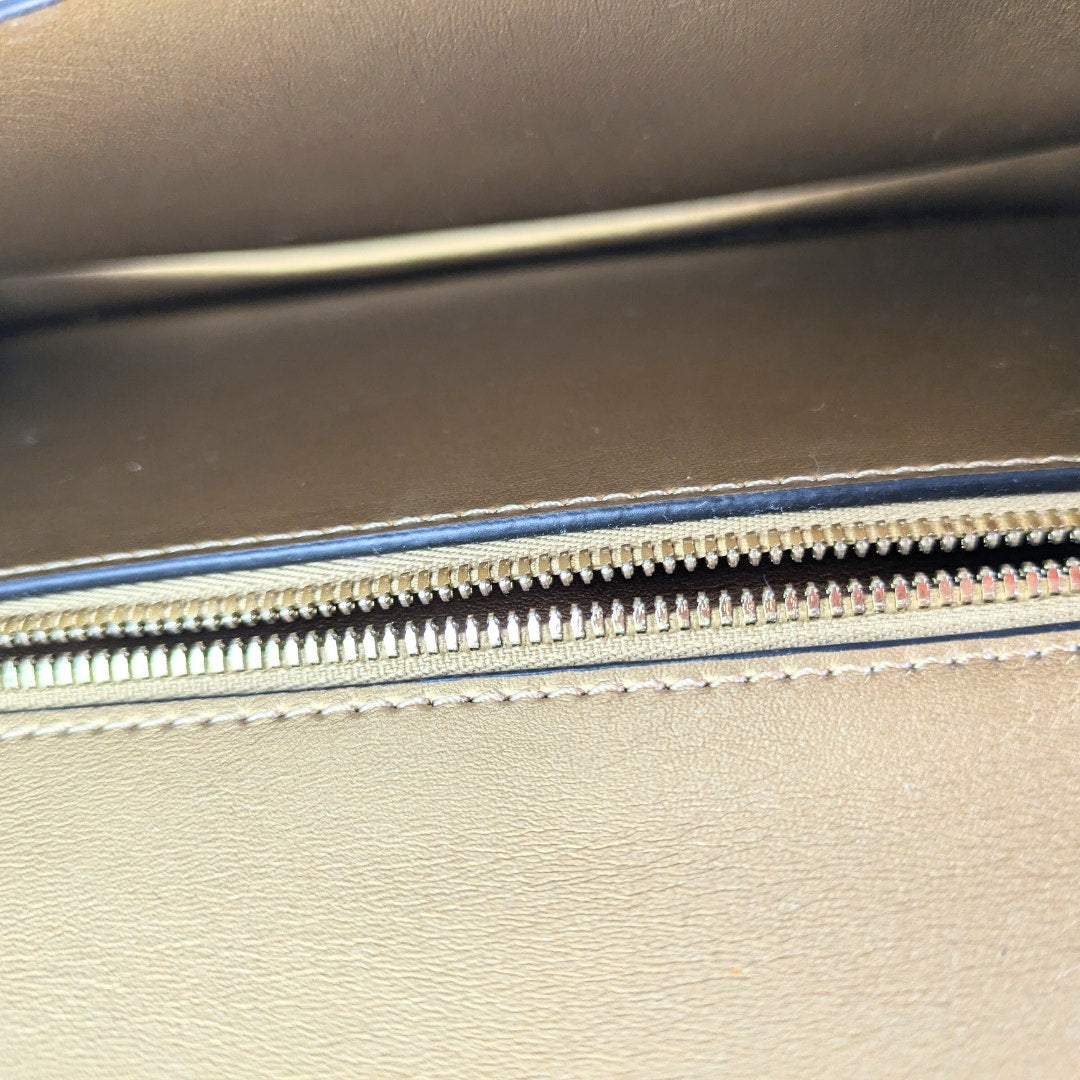 The interior of the Zac Posen Glitter Evening Clutch.