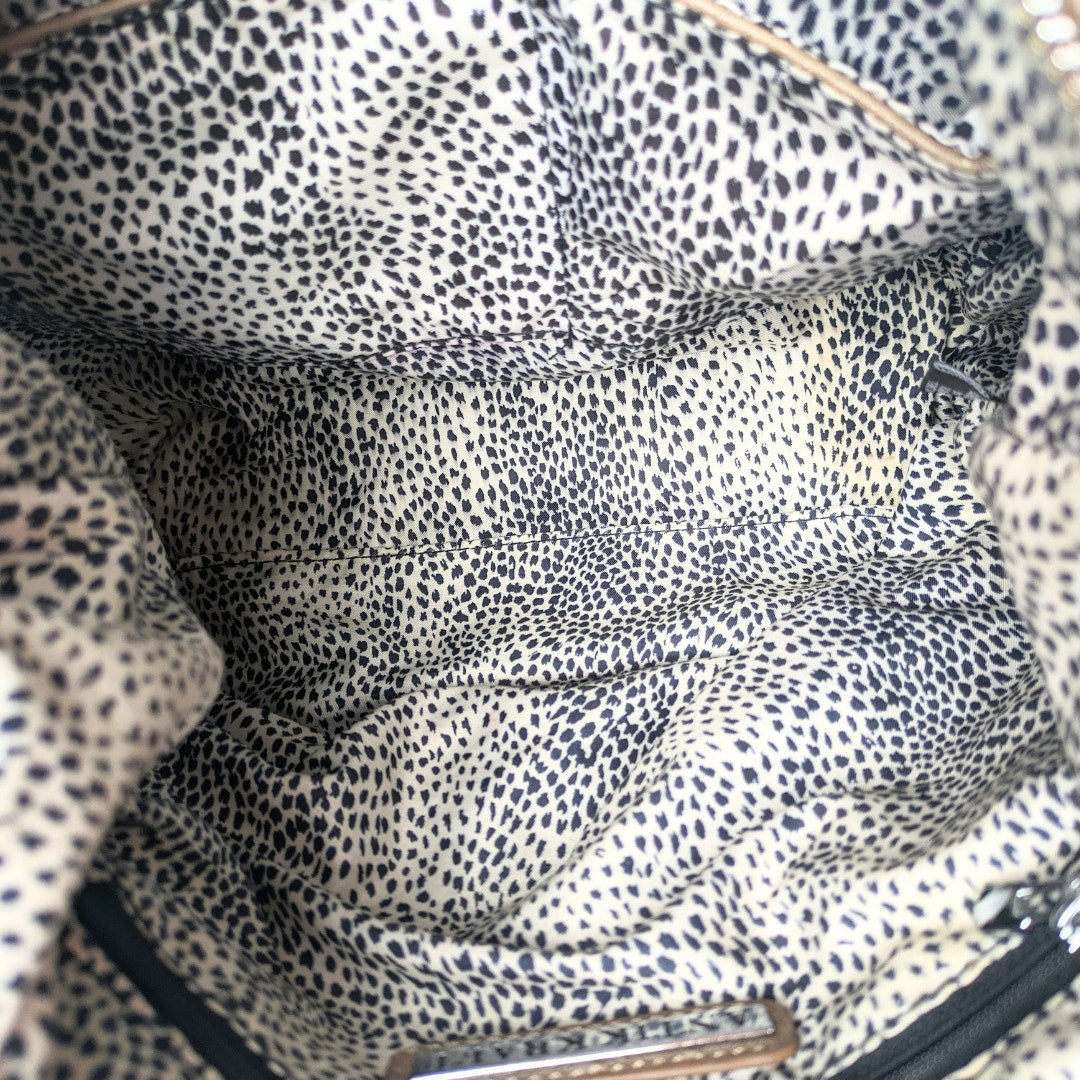 The inside of the Antik Kraft Brown Distressed Vegan Leather Harlow Zipper Satchel.