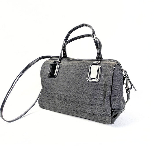 A pre-owned Coach Poppy Mini Oxford Convertible Satchel Handbag in gray canvas and black patent leather with silver hardware.