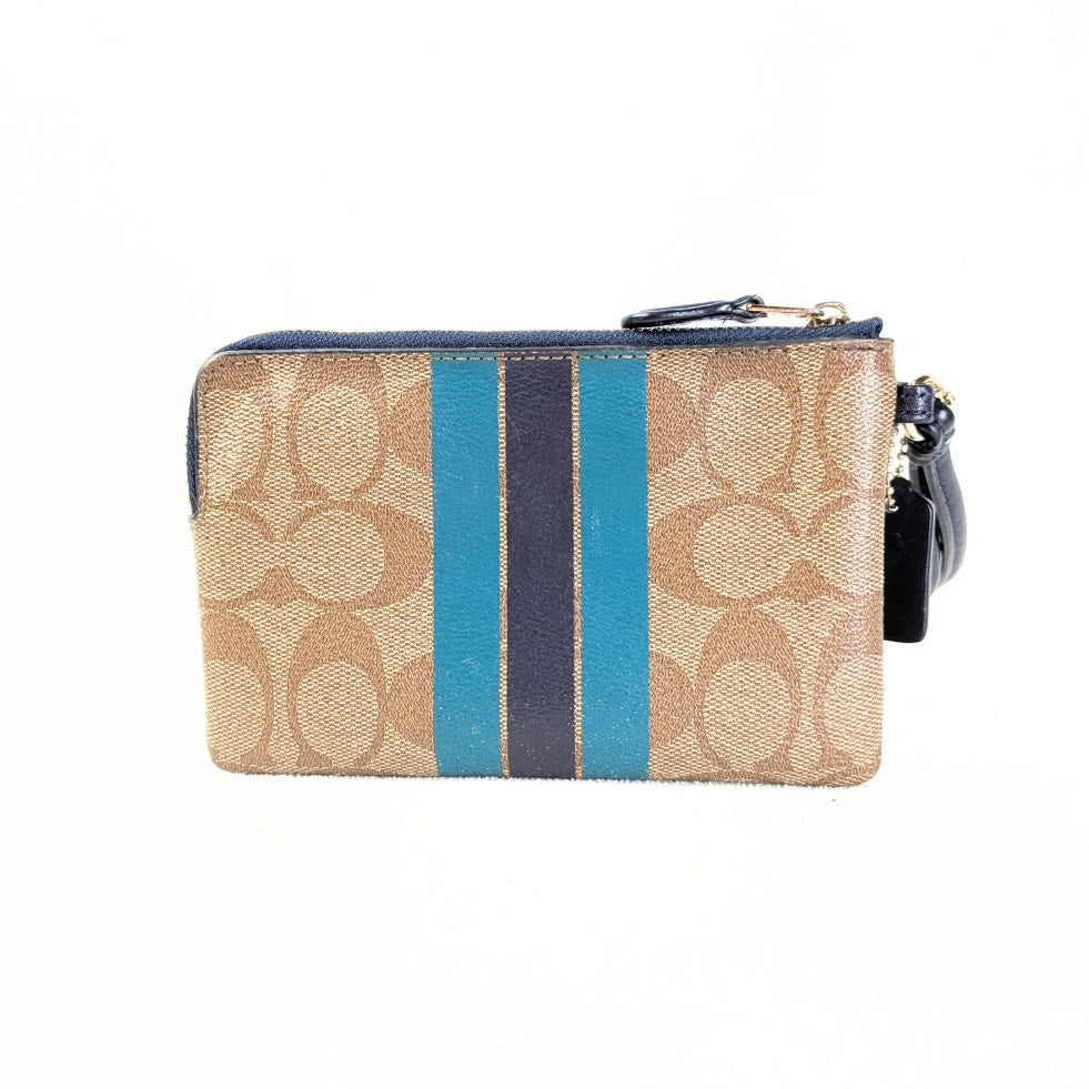 The back side of the COACH Signature Canvas Stripe Wallet Pouch photographed on the white background. 