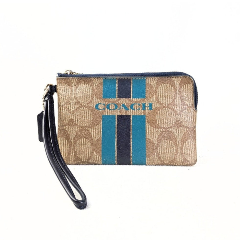 The view of the front side of the COACH Signature Canvas Stripe Wallet Pouch photographed on the white background. 