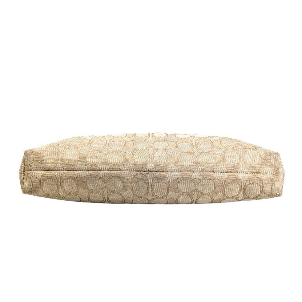 The bottom of the COACH Signature Jacquard Crossbody Bag.