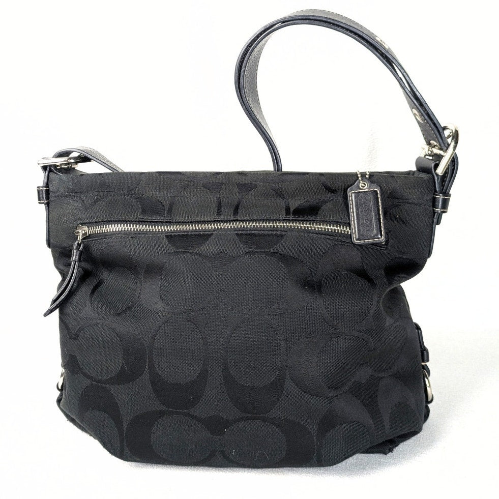 The back side of the Coach Monogram Hobo Shoulder Bag, captured on the white background. 