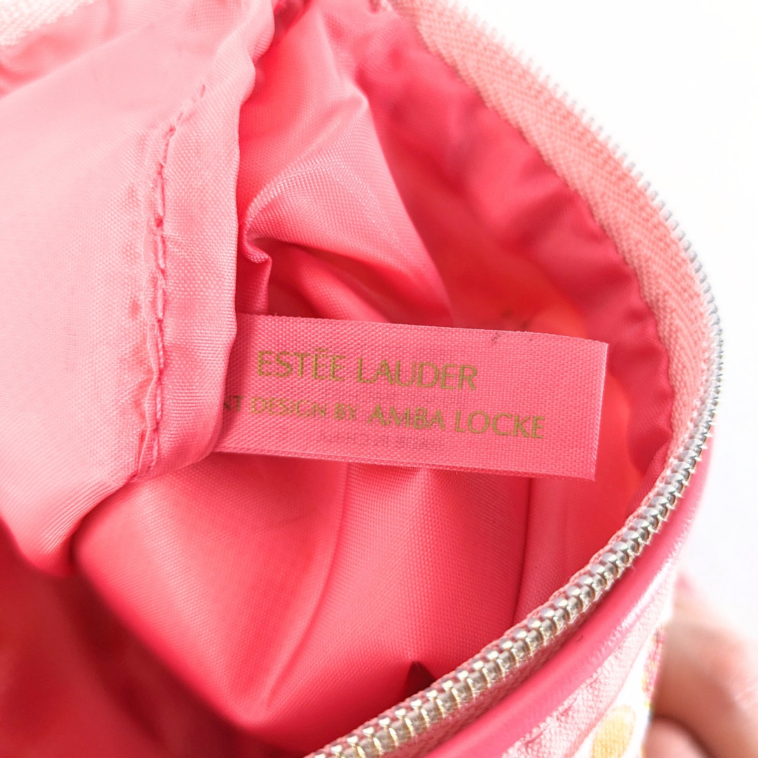 The interior tag og the Estée Lauder Small Citrus Fruits Print Makeup Bag.