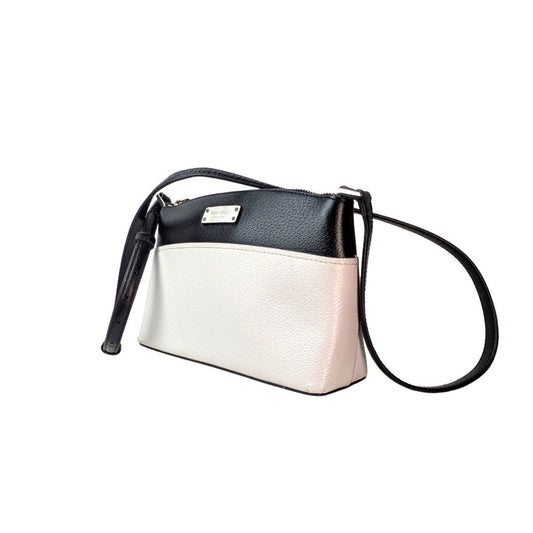 Two-tone black and white Kate Spade New York Millie Grove Street Crossbody Bag handbag with a strap on a white background.