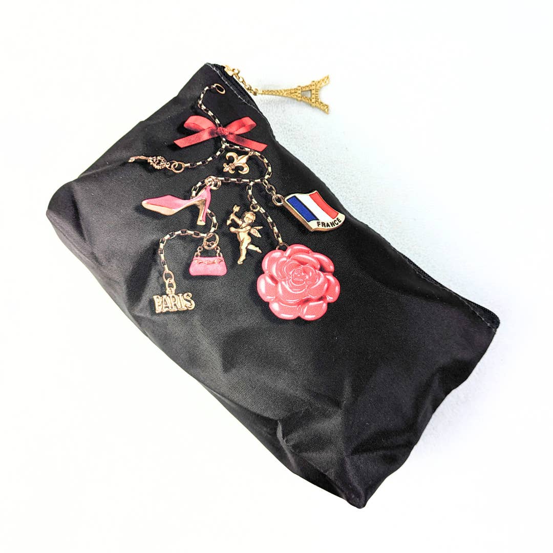 The view from the top of the Lancôme Nylon Cosmetic Bag with Eiffel Tower Zipper Handle. captured on the white background. 