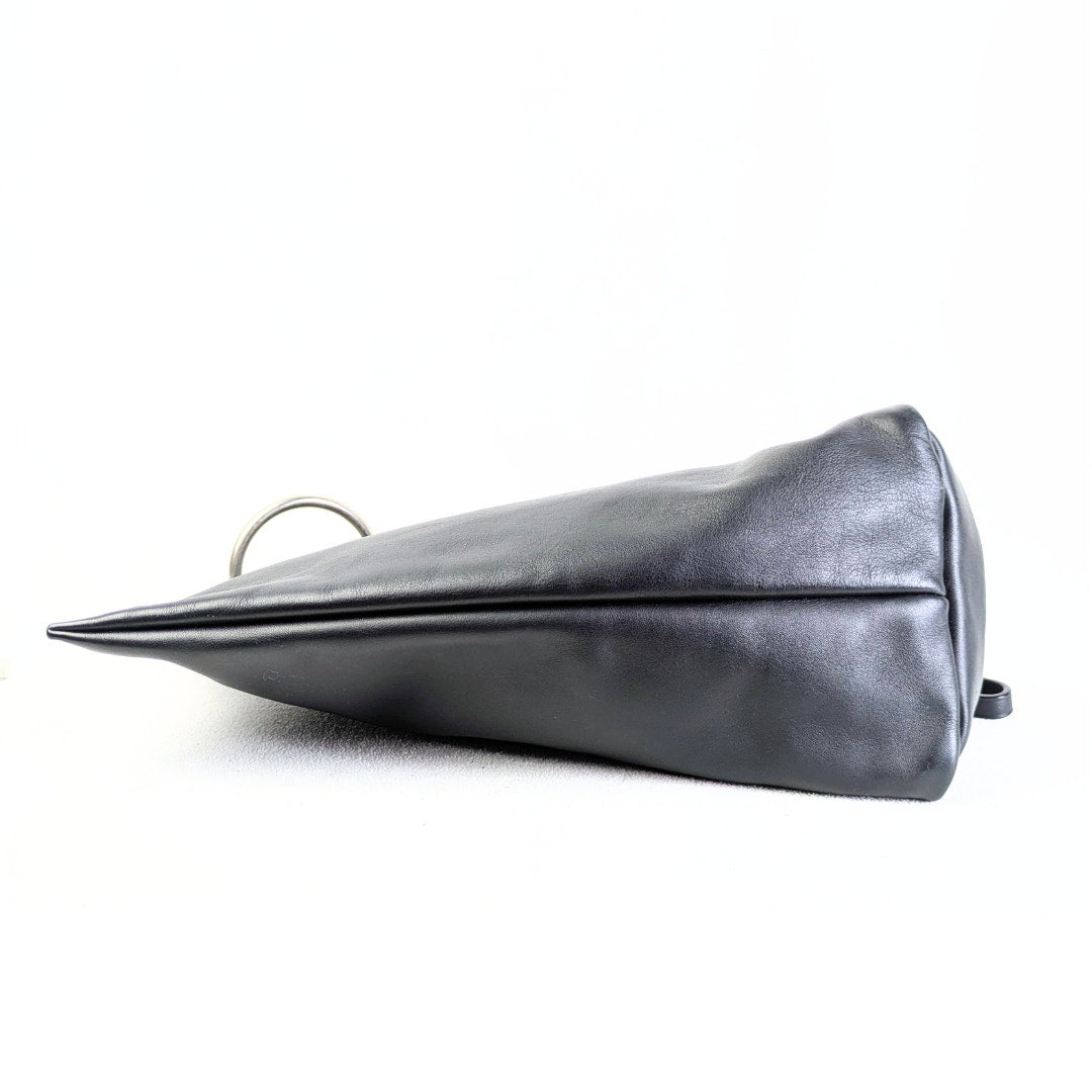 Marc by Marc Jacobs Handbag Prism Clutch in Black photographed from the thicker side. 