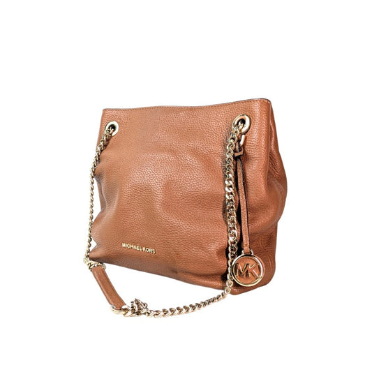 A pre-owned Michael Kors Jet Set Chain Medium Tote Bag in brown color with gold-tone hardware, chain shoulder straps, and a signature logo hand tag.