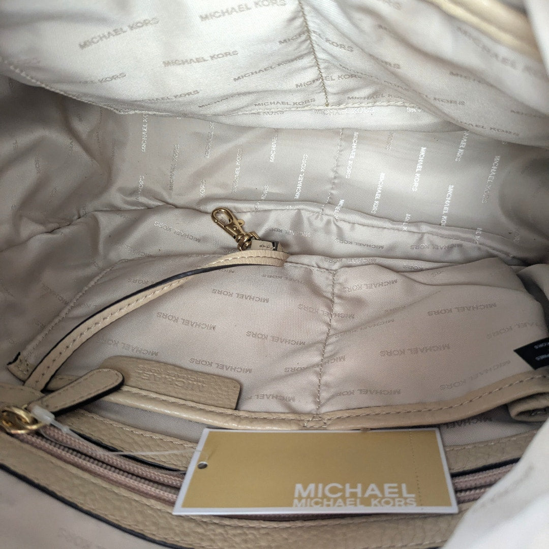 The lined interior of the Michael Kors Raven Large Leather Shoulder Bag. 