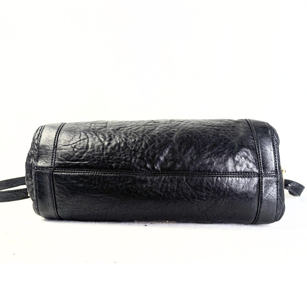 The bottom of the Michael Kors Stanthorpe Leather Rectangle Tote Handbag.