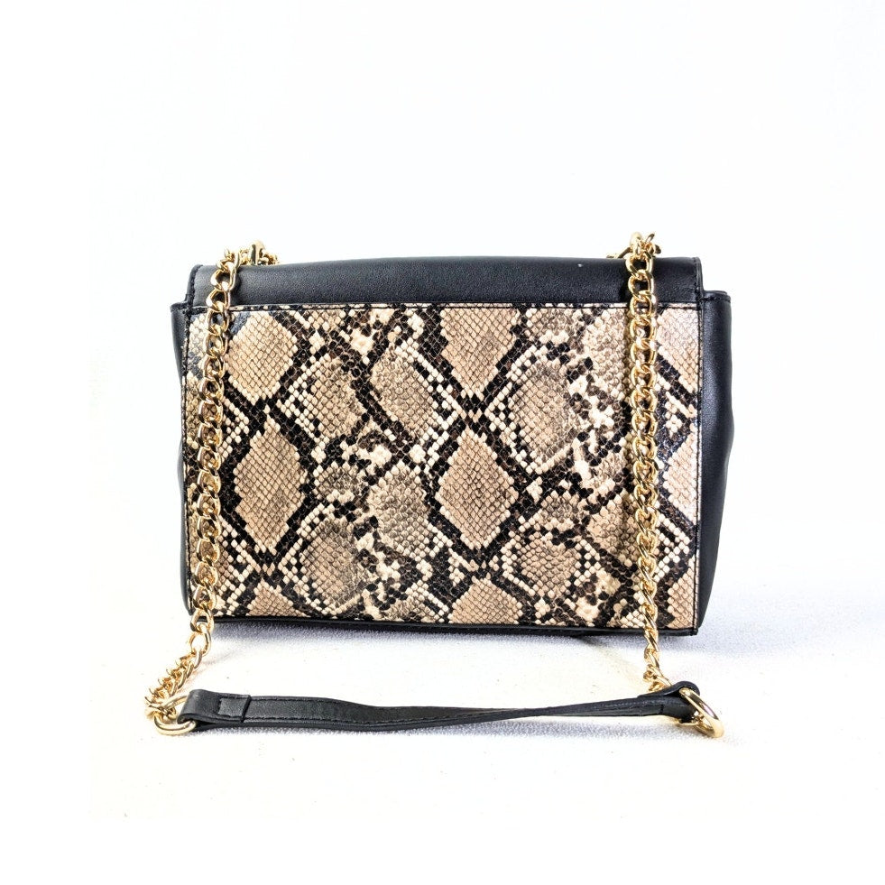The back side of the Nine West Bedford Animal Print Chain Strap Shoulder Bag photographed on the white background. 