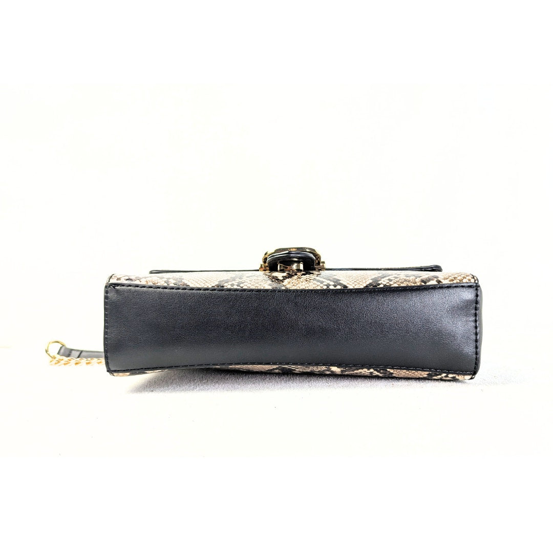 The view of the bottom of the Nine West Bedford Animal Print Chain Strap Shoulder Bag captured on the white background. 