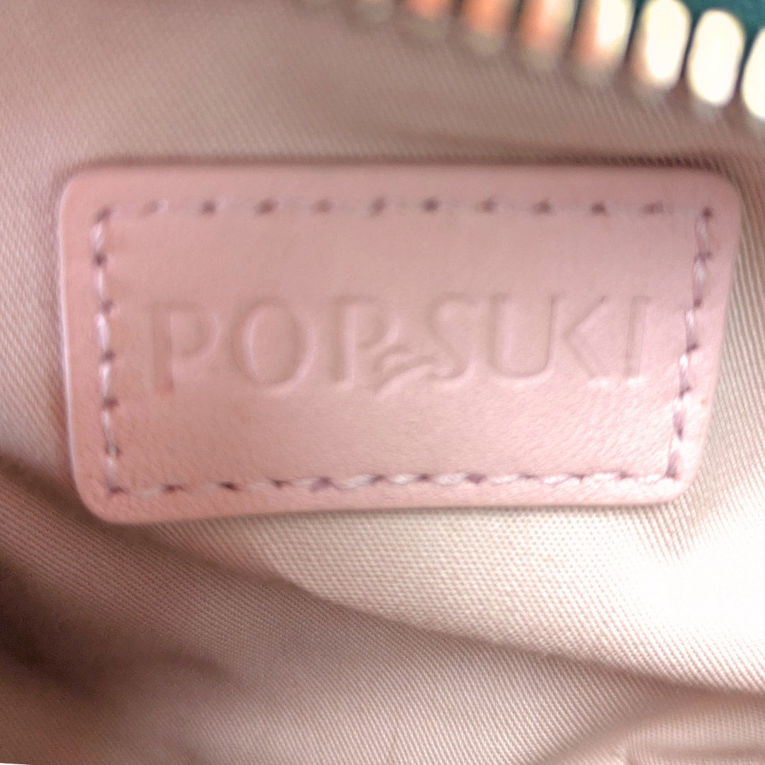 The leather embossed logo patch inside the Pop & Suki Crocodile Embossed Leather Camera Crossbody Bag.