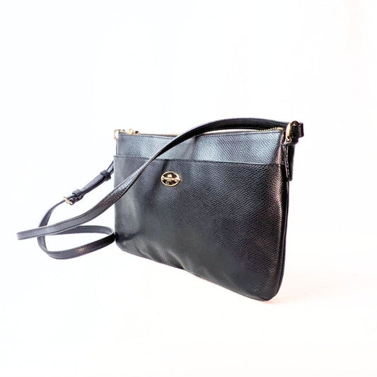 Pre-owned COACH Polly Crossgrain Leather Crossbody Bag in Black photographed form the side. 