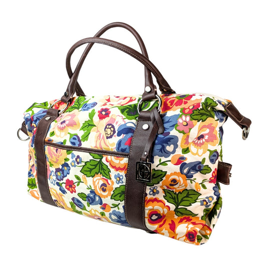 Pre-owned Giani Bernini Floral Print Canvas Diper Bag/ Travel Bag/ Duffle Bag photographed from the side. 