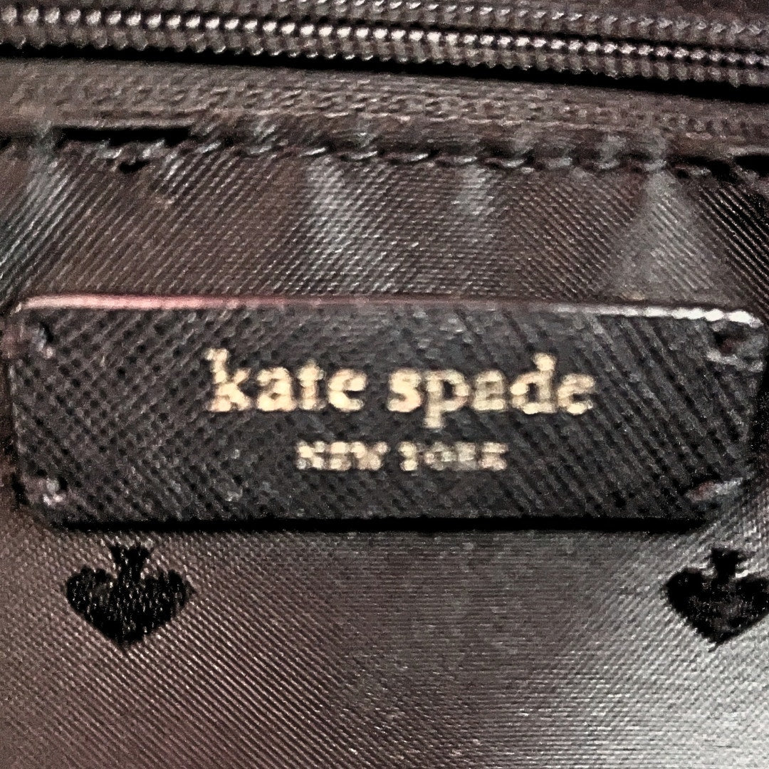 Interior logo patch of the Kate Spade Cameron Satchel Crossbody Bag in Black.