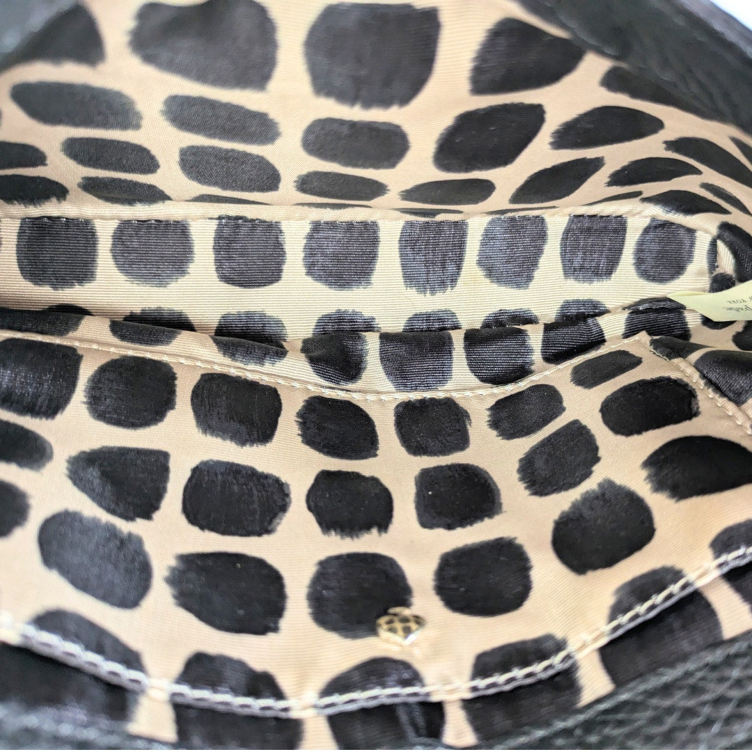 Interior of the Kate Spade Sadie Envelope Mini Crossbody Bag.