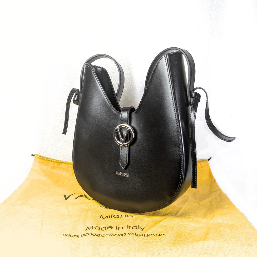 The left side view of the Valentino by Mario Valentino Anny Soave Shoulder Bag in Black.